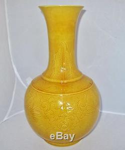 12.7 Chinese Incised Porcelain Vase with Yellow Drip Glaze on Wood Display Stand