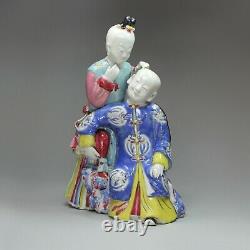 Chinese famille rose'ear-cleaning' figure group, Qianlong (1736-95)